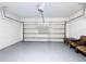 Bright garage with epoxy floor and a new automatic door, offering ample space at 3105 Sangria St, Kissimmee, FL 34744