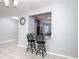 View of kitchen pass-through with granite counters from dining room with bar seating at 3105 Sangria St, Kissimmee, FL 34744