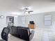 Bright living room with tile floors, comfortable seating, and view into the kitchen area at 3105 Sangria St, Kissimmee, FL 34744