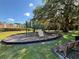 Community playground featuring a play structure with a climbing wall and wooden benches at 3105 Sangria St, Kissimmee, FL 34744