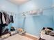 Spacious walk-in closet with wire shelving for clothes and storage and tile flooring at 3105 Sangria St, Kissimmee, FL 34744