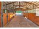 Spacious barn interior with individual stalls and good ventilation to ensure animal comfort and health at 3255 Tucker Ave, St Cloud, FL 34772