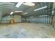 Large barn with roll-up door and plenty of interior storage space at 3255 Tucker Ave, St Cloud, FL 34772