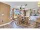 Cozy dining area with a view of the backyard and access to kitchen at 3255 Tucker Ave, St Cloud, FL 34772