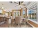 Dining room featuring bay windows, backyard views, and a ceiling fan at 3255 Tucker Ave, St Cloud, FL 34772