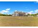 Beautiful two-story home with a screened-in patio and expansive backyard, perfect for outdoor enjoyment and relaxation at 3255 Tucker Ave, St Cloud, FL 34772