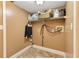 Practical laundry room with shelving, a washing machine hookup, and a clean, tiled floor at 3255 Tucker Ave, St Cloud, FL 34772