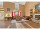 Bright living room with soaring ceilings, lots of light and stone fireplace with built-ins at 3255 Tucker Ave, St Cloud, FL 34772