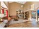 Spacious living room featuring a stone fireplace, vaulted ceilings, and hardwood floors at 3255 Tucker Ave, St Cloud, FL 34772