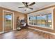 Office space featuring large windows with pool views and a dedicated work area at 3255 Tucker Ave, St Cloud, FL 34772