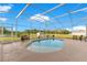 Relaxing screened-in pool area with comfortable seating and picturesque views of the surrounding landscape at 3255 Tucker Ave, St Cloud, FL 34772