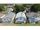 Overhead angle shows homes with enclosed pools and yards plus solar panels, showcasing the community's features at 334 Grosvenor Loop, Davenport, FL 33897