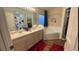 Bathroom with double vanity, large tub, and unique shower curtain. Great for ! at 334 Grosvenor Loop, Davenport, FL 33897