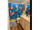 Bathroom with double vanity and a Mario themed shower curtain; creative and fun for  at 334 Grosvenor Loop, Davenport, FL 33897