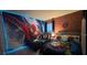 Themed bedroom with colorful Spiderman motif, offers an exciting and fun experience at 334 Grosvenor Loop, Davenport, FL 33897