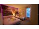 Cute bedroom with two twin beds, colorful walls, and charming decor, kid-friendly and modern at 334 Grosvenor Loop, Davenport, FL 33897