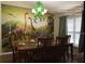 Elegant dining room with table set for six at 334 Grosvenor Loop, Davenport, FL 33897
