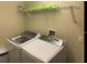 Modern laundry room with front-load washer and dryer at 334 Grosvenor Loop, Davenport, FL 33897
