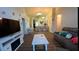 Spacious living room with lots of seating and natural light at 334 Grosvenor Loop, Davenport, FL 33897