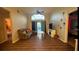 Open living area with vinyl floors and access to a screened patio, perfect for entertaining at 334 Grosvenor Loop, Davenport, FL 33897