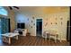 Open living area with vinyl floors, desk area, and view of screened patio, perfect for families at 334 Grosvenor Loop, Davenport, FL 33897