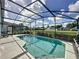 Inviting pool in screened in pool area at 334 Grosvenor Loop, Davenport, FL 33897