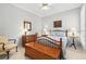 Charming bedroom with traditional furnishings, hardwood floors and soft, natural lighting at 3421 Capland Ave, Clermont, FL 34711