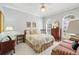 Comfortable bedroom with natural light, a ceiling fan, and traditional furnishings at 3421 Capland Ave, Clermont, FL 34711