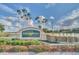 Community entrance sign featuring lush landscaping, a water feature, and clear signage for 'Kings Ridge' at 3421 Capland Ave, Clermont, FL 34711