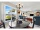 Bright dining room with views to the backyard and a dining area at 3421 Capland Ave, Clermont, FL 34711