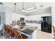 Modern kitchen with white cabinets, stainless steel appliances, and granite countertops at 3421 Capland Ave, Clermont, FL 34711