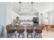 Modern kitchen island features granite countertops and barstool seating at 3421 Capland Ave, Clermont, FL 34711