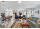 Spacious living room with an area rug and an open layout to the kitchen at 3421 Capland Ave, Clermont, FL 34711