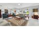 Bright living room with an area rug and views of the dining room at 3421 Capland Ave, Clermont, FL 34711