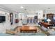 Bright, open-concept living room with a view to the kitchen at 3421 Capland Ave, Clermont, FL 34711