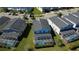 Aerial view of homes featuring screened-in pools, perfect for outdoor relaxation and entertainment at 345 Ocean Course Ave, Davenport, FL 33896