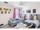 Themed bedroom with two beds, ceiling fan, and decor of popular characters at 345 Ocean Course Ave, Davenport, FL 33896