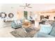 Bright living room with modern decor, stylish seating, and an open layout at 345 Ocean Course Ave, Davenport, FL 33896