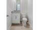 Bathroom showing granite vanity, white cabinet, neutral wall color, and neutral flooring at 348 Conway Ave, St Cloud, FL 34771