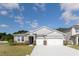 A well-maintained single-Gathering home with a two-car garage on a sunny day at 348 Conway Ave, St Cloud, FL 34771