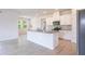 Bright kitchen with white cabinets, granite countertops, and stainless appliances at 348 Conway Ave, St Cloud, FL 34771