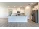 Modern kitchen featuring white cabinets, stainless steel appliances, and an island at 348 Conway Ave, St Cloud, FL 34771