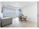 Living room area with kitchenette, dining table, and couch at 348 Conway Ave, St Cloud, FL 34771
