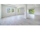 Spacious living room with neutral wall colors, neutral flooring, and abundant natural light at 348 Conway Ave, St Cloud, FL 34771