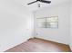 Bright, vacant bedroom featuring a ceiling fan, closet, window and laminate flooring at 3503 S Crystal Lake Dr, Orlando, FL 32806