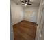 Vacant bedroom with ceiling fan, closet, and laminate flooring at 3503 S Crystal Lake Dr, Orlando, FL 32806