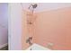 Close-up of the pink-tiled shower with showerhead and faucet at 3503 S Crystal Lake Dr, Orlando, FL 32806