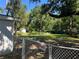 Spacious backyard featuring a chain-link fence and lush greenery at 3815 Nw Avenue R Ave, Winter Haven, FL 33881