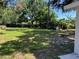 Expansive backyard with lush greenery and trees at 3815 Nw Avenue R Ave, Winter Haven, FL 33881