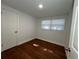 Bedroom featuring a window and hardwood floors at 3815 Nw Avenue R Ave, Winter Haven, FL 33881